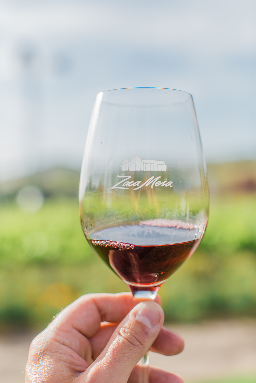 Zaca Mesa Wine glass with logo and filled with red wine