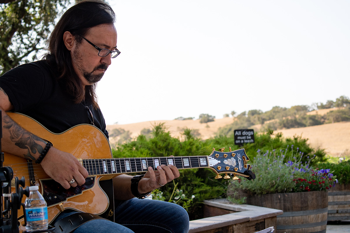 Adrian Galysh playing guitar at Zaca Mesa