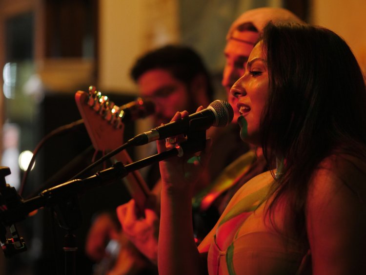 Natalie Espinoza singing with group