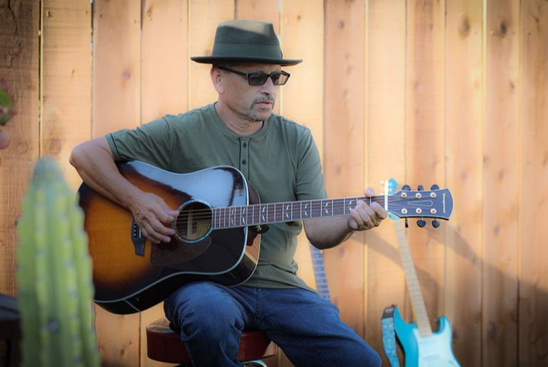Victor Valencia playing guitar